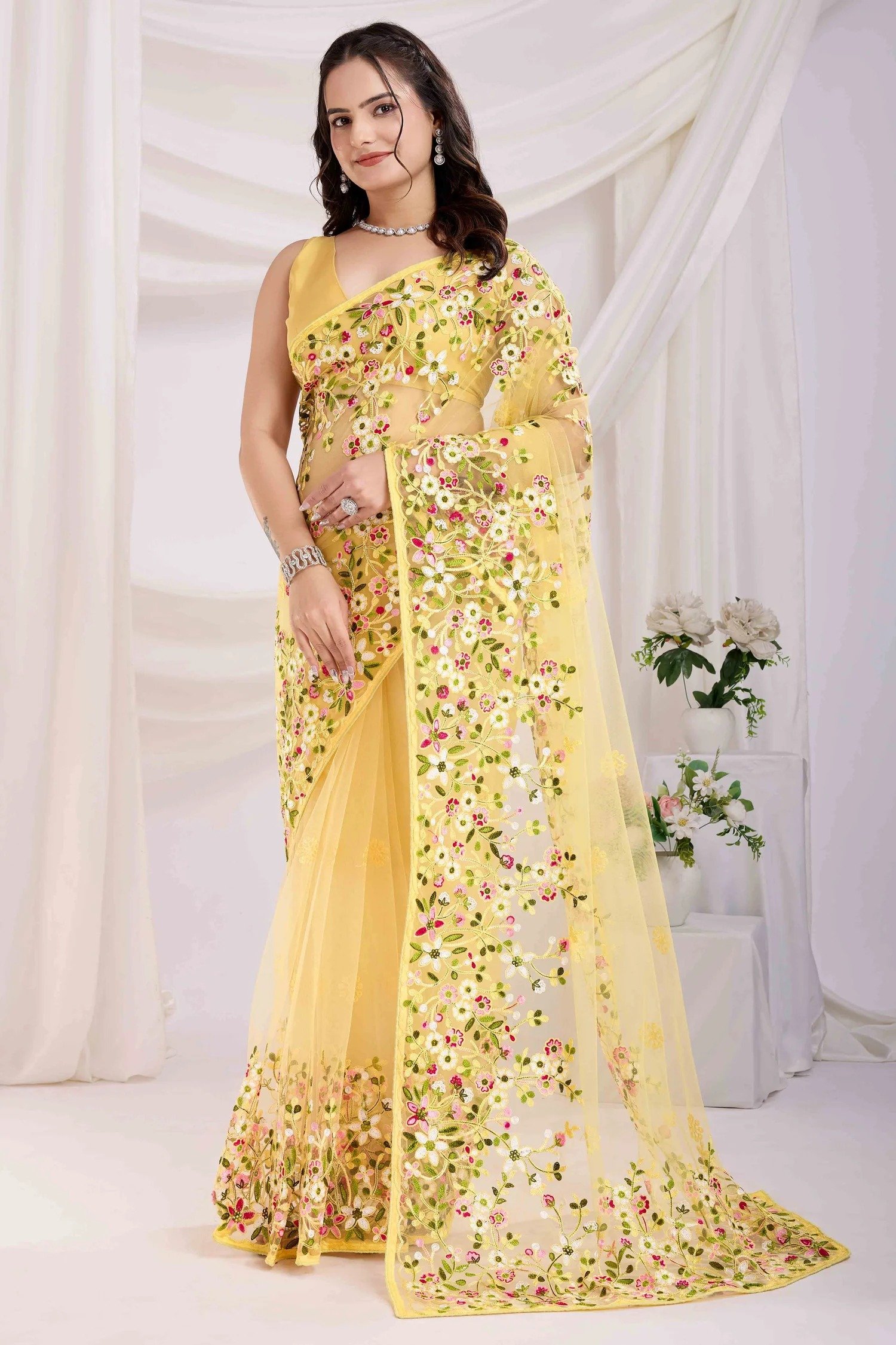 imgi_64_1_VVINT-VAAMIKA21-62874-PEACHMODE Yellow Floral Embroidered Net Saree - Image 1