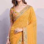 Yellow Bandhani Printed Georgette Saree With Embroidered Lace Border - Image 4